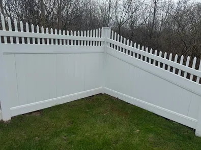 Fence after soft washing, wood grain visible and clean